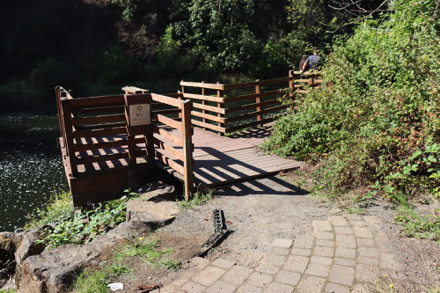 Paved trail transitions to pavers – transition to wooden deck may need maintenance